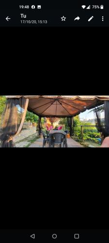 a picture of a picnic table with an umbrella at Le rose di Mapi in Mango