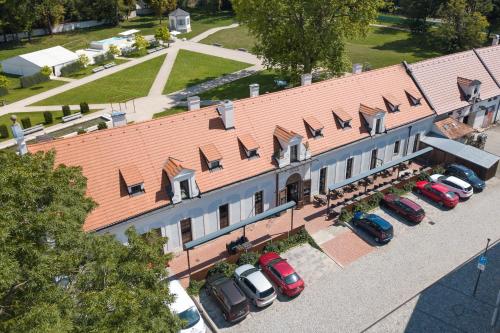 an overhead view of a building with cars parked in a parking lot at Olivův Pivovar in Dolní Břežany