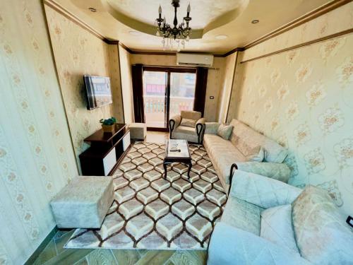 a living room with a couch and a table at سى فيو السريا in Alexandria
