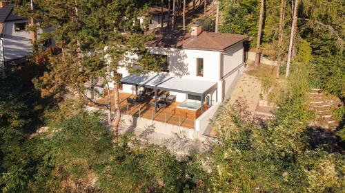 an overhead view of a white house with a roof at Vila Hradištko in Hradištko