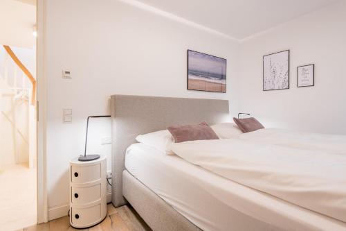 En eller flere senge i et værelse på Landhaus Hygge