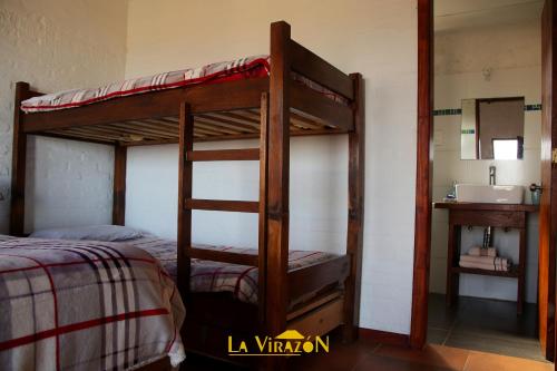 Ένα ή περισσότερα κρεβάτια σε δωμάτιο στο Hostal La Virazón