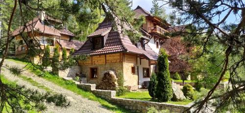 a house in the woods with trees at SVETLA U PLANINI in Bajina Bašta