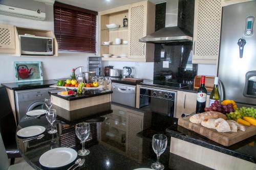 a kitchen with a counter with wine glasses on it at Ti’amo in Wilderness