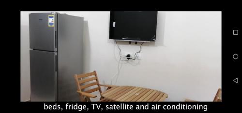 Μια τηλεόραση ή/και κέντρο ψυχαγωγίας στο صيف في جراند هيلز الساحل الشمالي