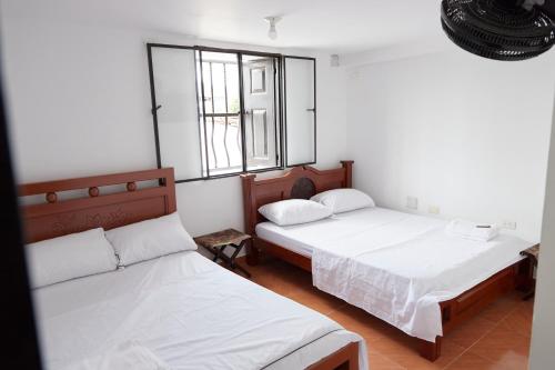 Cama o camas de una habitación en Hotel Gran Girones