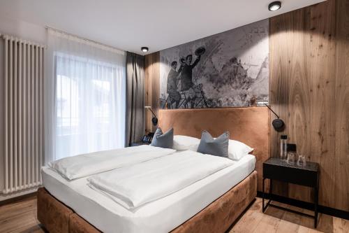 Posteľ alebo postele v izbe v ubytovaní Linder Cycling Hotel