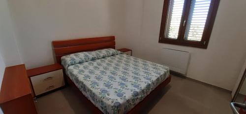 Ένα ή περισσότερα κρεβάτια σε δωμάτιο στο Casa vacanza Luisa