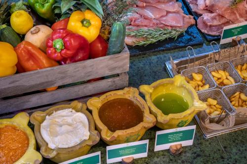a display of different types of fruits and vegetables at Vilar Rural De Sant Hilari Sacalm by Serhs Hotels in Sant Hilari Sacalm