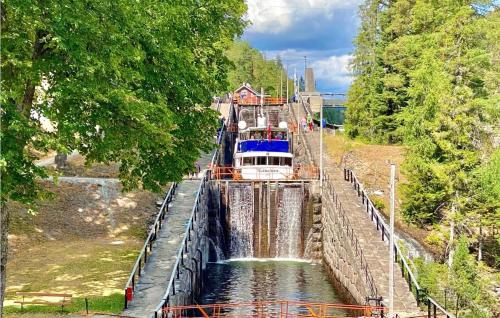 a boat in the middle of a canal at Amazing Home In Lunde With Wifi in Lunde