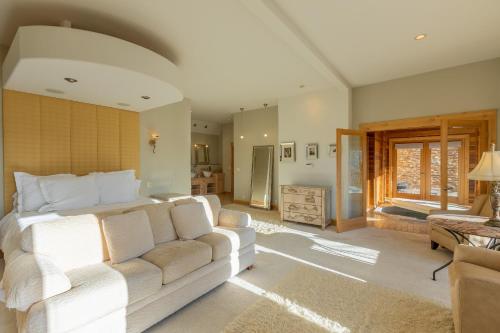 a living room with a bed and a couch at Nordic Inn in Crested Butte
