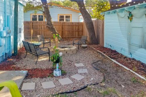 a backyard with a table and chairs and a tree at Cozy BeachandFishing Cottage in Aransas Pass! in Aransas Pass