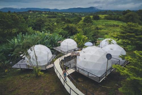 a group of four domes in a field at นรดีฮิวล์ รีสอร์ต เขาแผงม้า วังน้ำเขียว in Ban Sap Bon