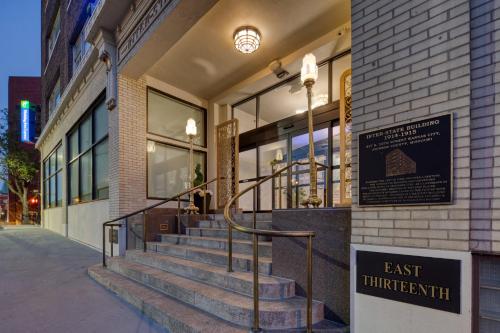 a building with stairs in front of a store at Holiday Inn Express Kansas City Downtown in Kansas City