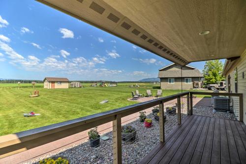 a deck with a view of a yard at Columbia Falls Home with 1-Acre Yard and Views! in Columbia Falls