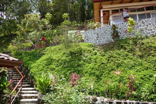 a house with stairs leading up to a garden at Bungalows Sanlaz in Barrio Jesús