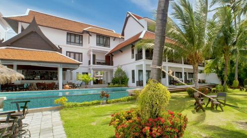 an image of a villa with a swimming pool at Baan Bophut Beach Hotel Samui - SHA Extra Plus in Bophut