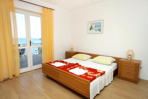Postel nebo postele na pokoji v ubytování Apartment Molunat 3544a