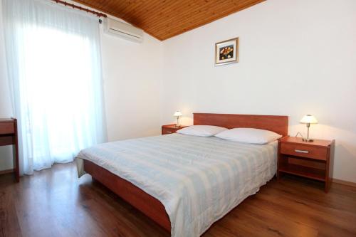 Postel nebo postele na pokoji v ubytování Studio Mandre 3557b