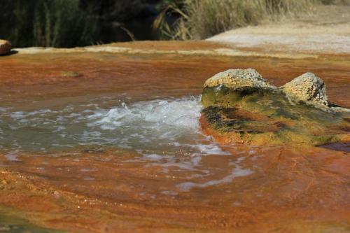 a pool of water with two rocks in the water at Jermuk Moscow Health Resort in Jermuk