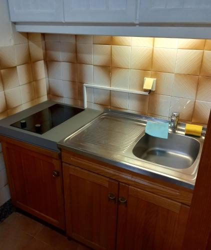 a kitchen with a sink and a counter top at Apartments with parking space Cavtat, Dubrovnik - 2132 in Cavtat
