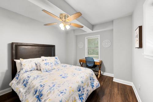 a bedroom with a bed and a ceiling fan at The Secluded Secret in Stone Mountain in Stone Mountain