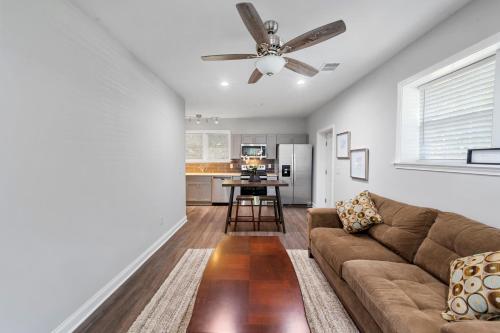 a living room with a couch and a ceiling fan at The Secluded Secret in Stone Mountain in Stone Mountain
