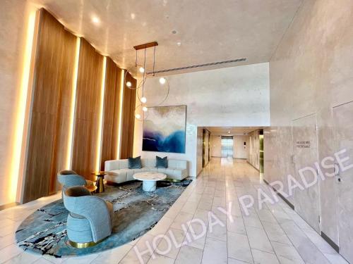 a living room with a couch and a table at Luxury S Casino Residences Broadbeach - Holiday Paradise in Gold Coast