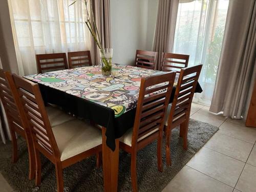 a dining room table with a table cloth on it at Cómoda Casa en mejor sector de la ciudad in Los Andes