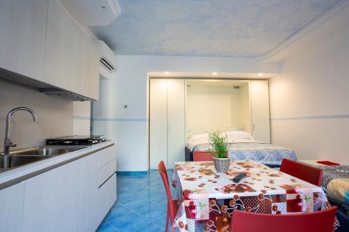 A kitchen or kitchenette at IL SOFFIO DI TIFEO - RESORT