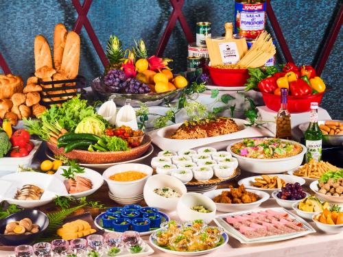 a table filled with lots of different types of food at Hotel Flags Kuju Kusima in Sasebo