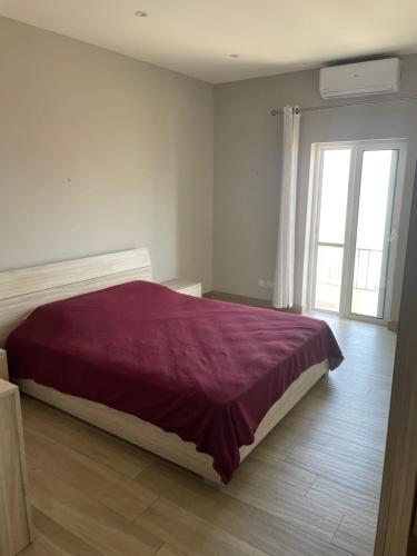 A bed or beds in a room at Windjammer