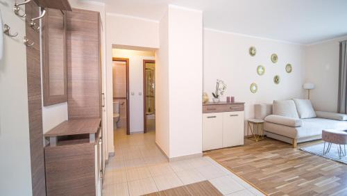 a living room with a couch and a table at Alpe Adria Apartments - Top 11 by S4Y in Oberaichwald