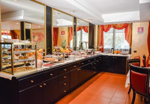 a buffet line with a lot of food on display at Hotel Motel Visconteo in Binasco