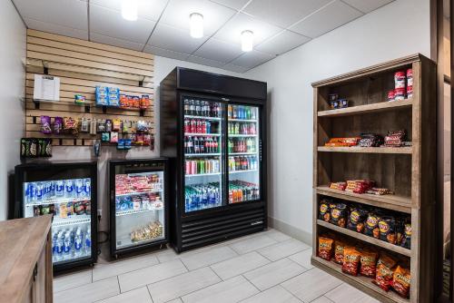 a grocery store with two refrigerators and drinks at Holiday Inn Express Flint-Campus Area by IHG in Flint