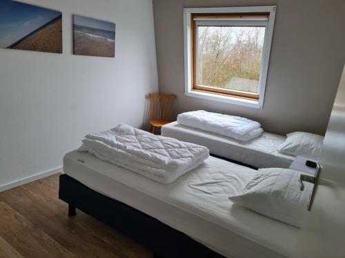 Postel nebo postele na pokoji v ubytování Kustverhuur, Park Schoneveld, Zeester 64