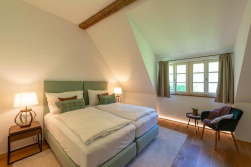 a bedroom with a large bed and a window at Landhaus Obersteinriegl in Gaflenz