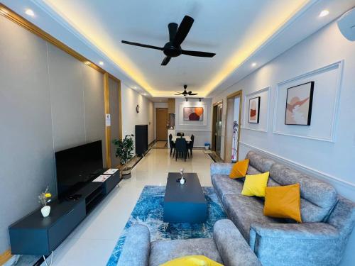 a living room with a couch and a ceiling fan at R&F PRINCESS COVE at ANJU in Johor Bahru