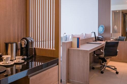 an office with a desk and a chair in a room at Oceanfront Beach Resort in Patong Beach