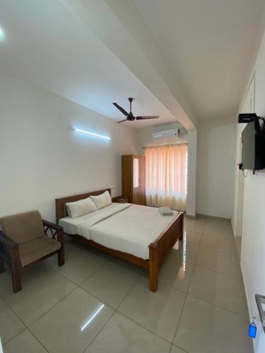 Cama o camas de una habitación en Solo Simrin Arcade Kadavanthra