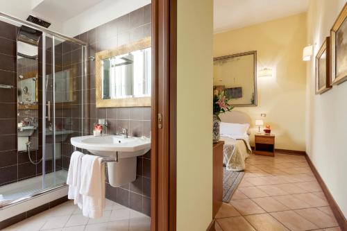 a bathroom with a sink and a shower at Vatican Domus in Rome