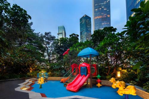 a playground in a park with a slide at Ascott IFC Guangzhou - Free Shuttle Bus For Canton Fair in Guangzhou