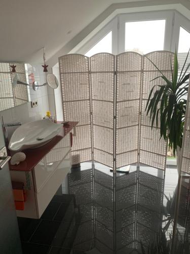 a bathroom with a sink and a window at Apartment in toller Lage am Rande des Ruhrgebietes in Bottrop