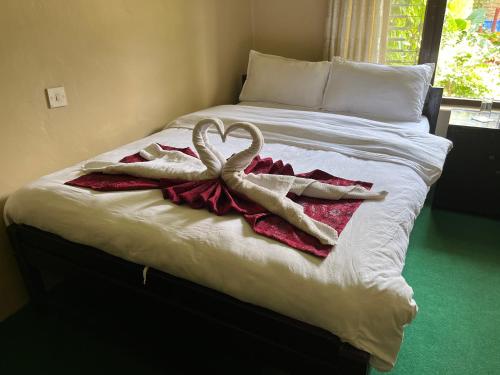 Postel nebo postele na pokoji v ubytování Nepali Cottage Guest House
