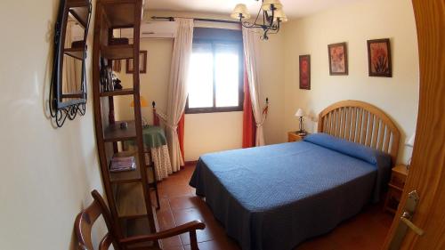 Postel nebo postele na pokoji v ubytování Villa 'El Cortijo' con piscina privada
