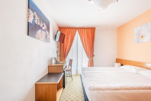 Voodi või voodid majutusasutuse Hotel Alpina toas
