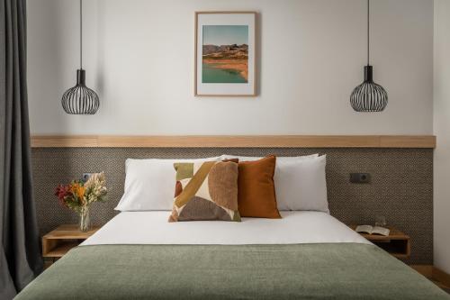 A bed or beds in a room at La Sal by Pillow