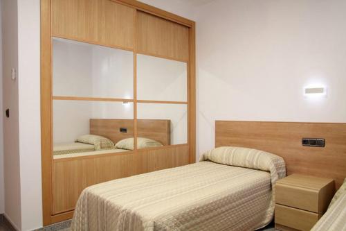 A bed or beds in a room at Hotel Albanta