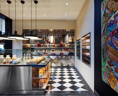 a restaurant kitchen with a checkered floor at citizenM Washington DC NoMa in Washington