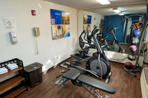 a gym with two exercise bikes in a room at Comfort Inn & Suites Midtown in Ruidoso